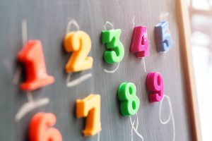 Colorful magnets of numbers one through nine.