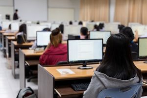Group of students studying in computer room