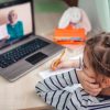 A young child on a video conference call.