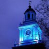 A clock tower at night on the Johns Hopkins University Homewood campus.