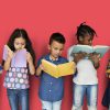 A group of children reading books.