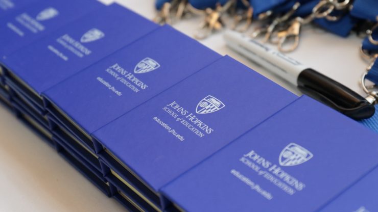 Notebooks that say Johns Hopkins School of Education.