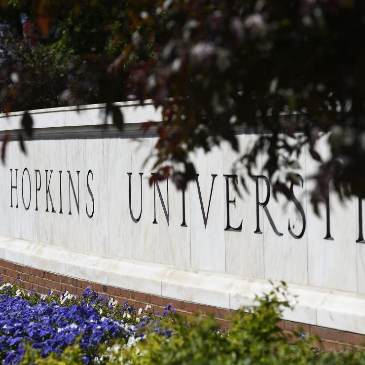 The Johns Hopkins University sign near the Beach on the Homewood campus.