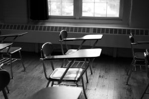Empty classroom chairs.