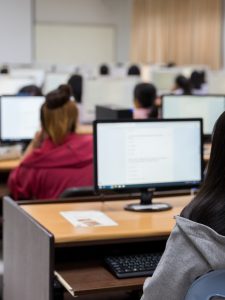 Students sitting in a computer lab.