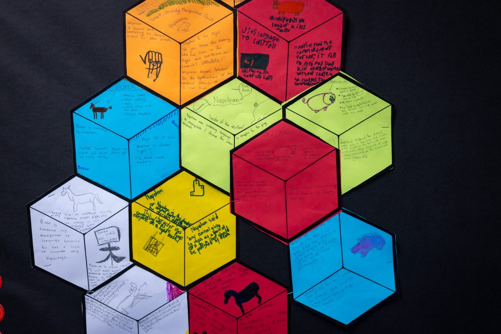 Children's artwork using colorful paper cubes