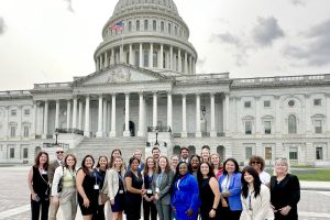 A group of Johns Hopkins School of Education students in front of the U.S. Capitol Building.