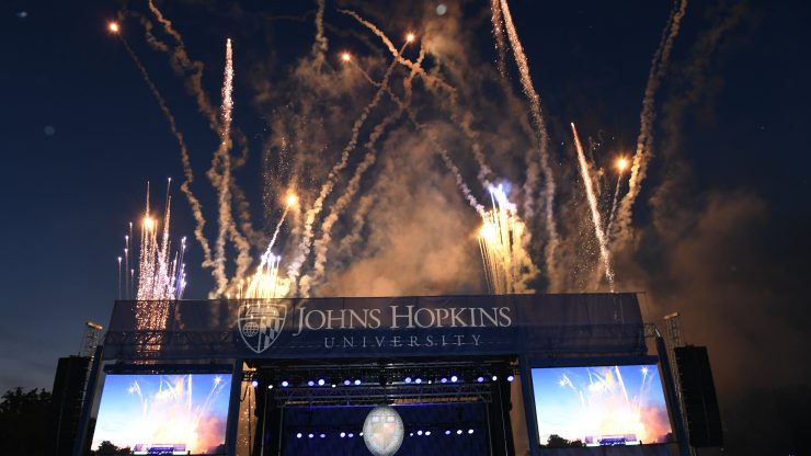Fireworks behind the Johns Hopkins School of Education Graduation stage on Homewood field
