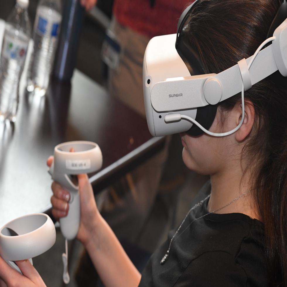 A person using a virtual reality headset.