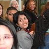A group of students, alumni, faculty and Staff listen to questions