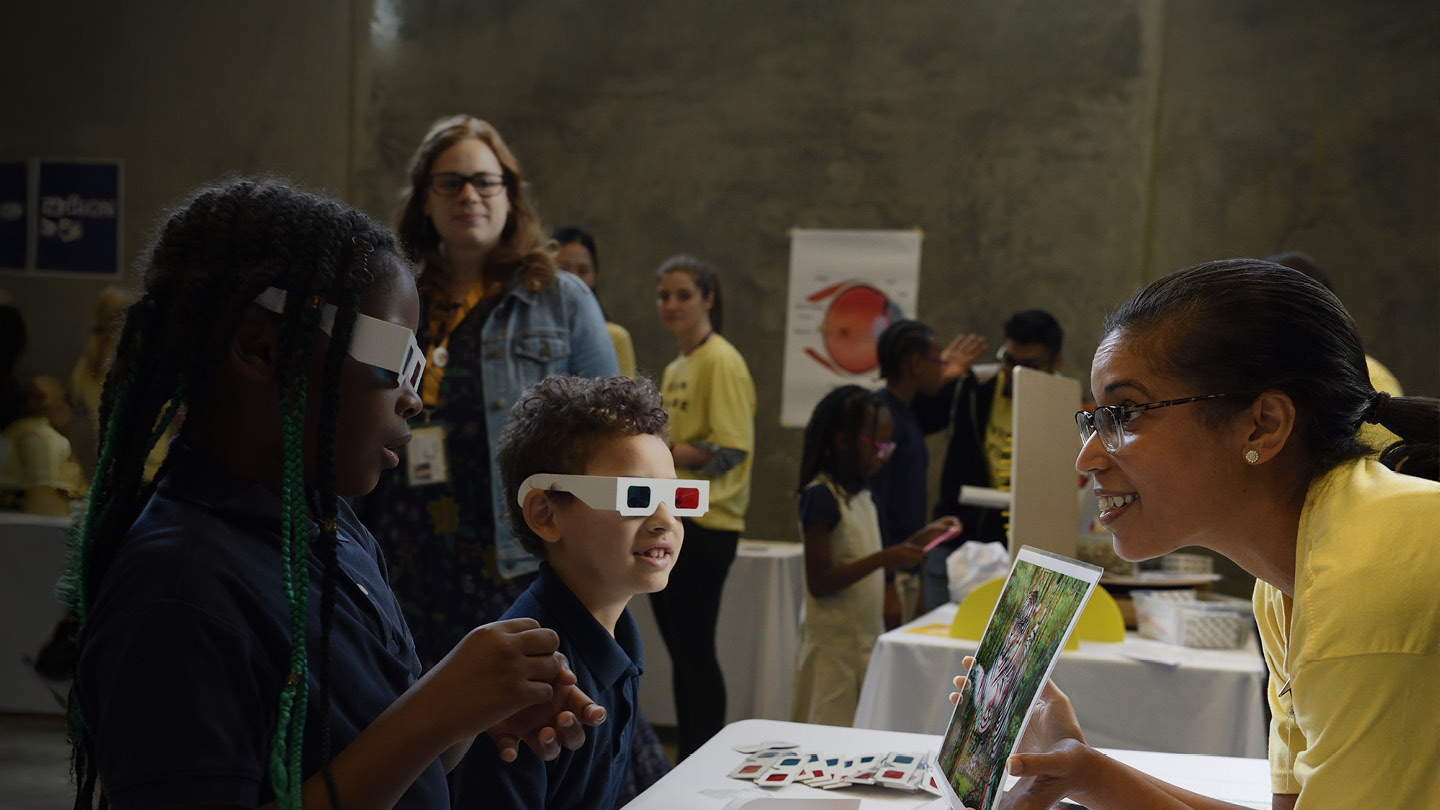 Vision for Baltimore showing students how 3D glasses work