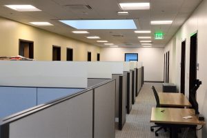 Cubicle office spaces with a skylight in the ceiling