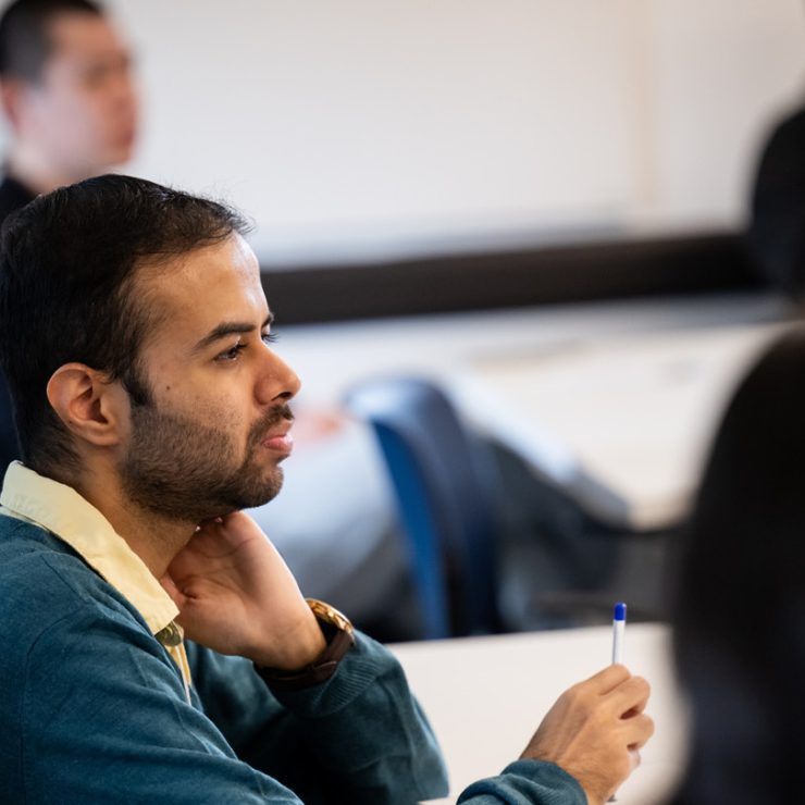 A person sitting in a classroom learning