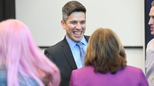 A person engaging in a conversation with someone